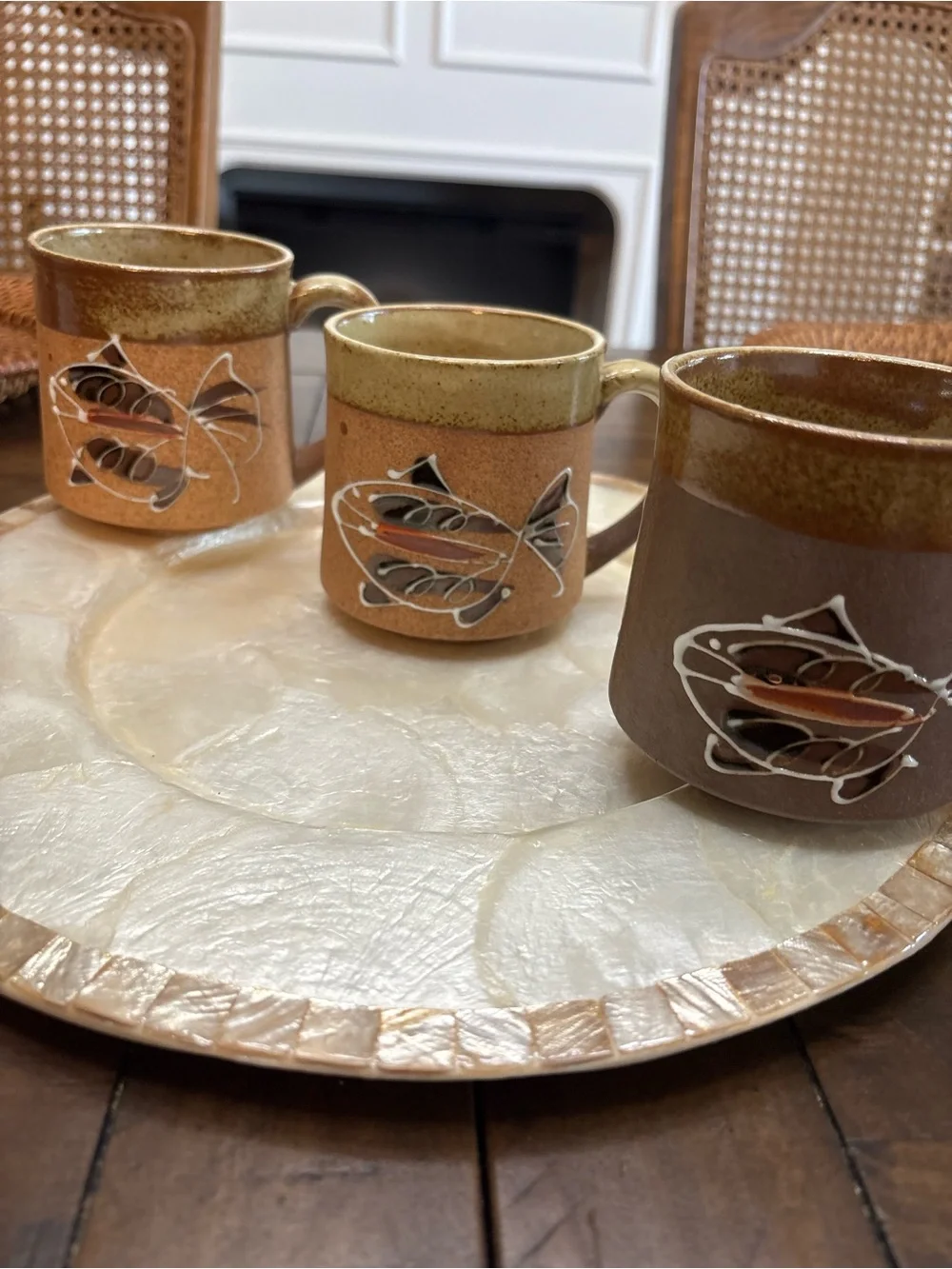 Three vintage stoneware pottery mugs with hand painted fish